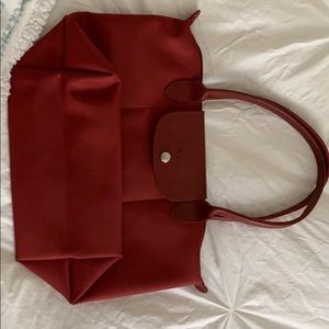 Used twice. Longchamp dark red tote.